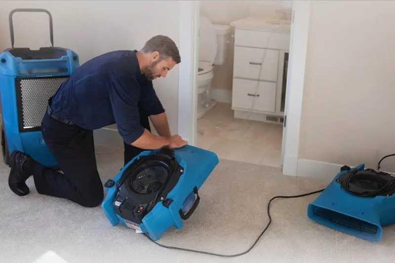 Chain O'Lakes Water Restoration technician drying a water damaged home in Antioch, IL