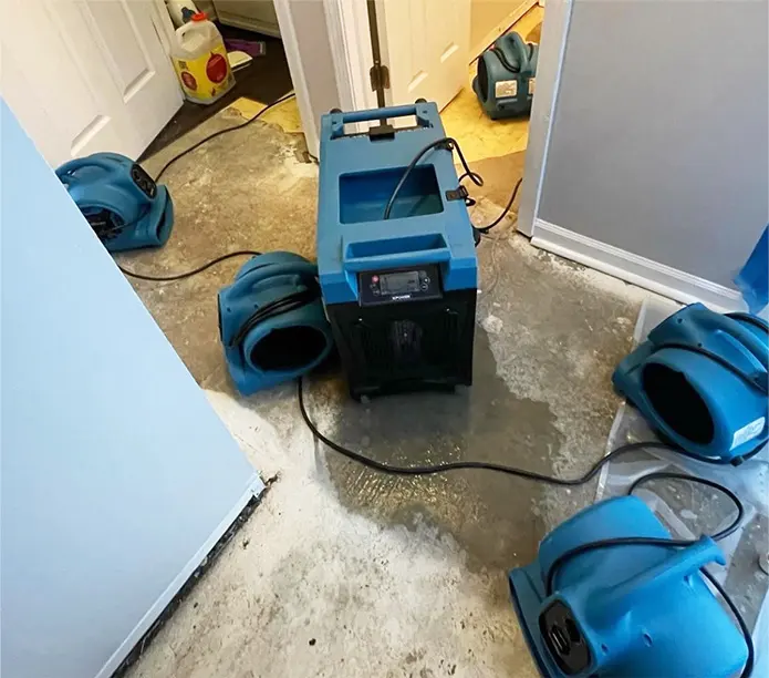 Air movers and a dehumidifier drying a doorway in Antioch, IL