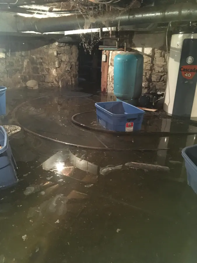A flooded basement being pumped out in Antioch, IL