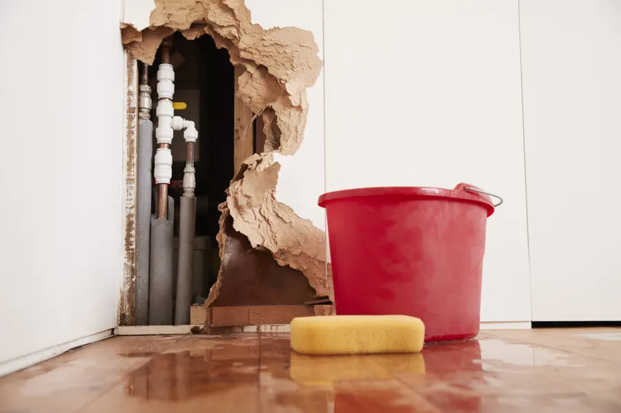 Burst pipe water damage and a hole in the wall in an Antioch, IL home